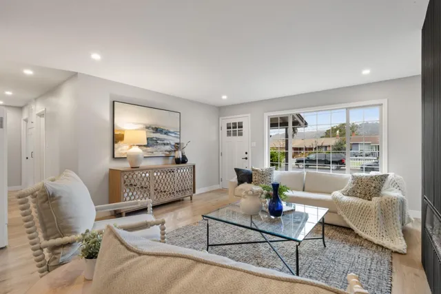 a living room with furniture and a table