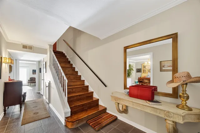 a view of a hallway with wooden floor and workspace