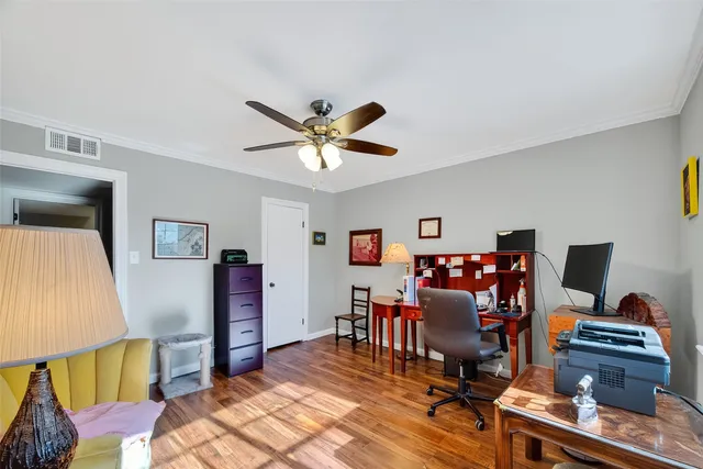 a workspace with furniture and wooden floor