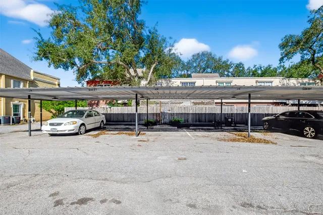 a view of parking with cars parked