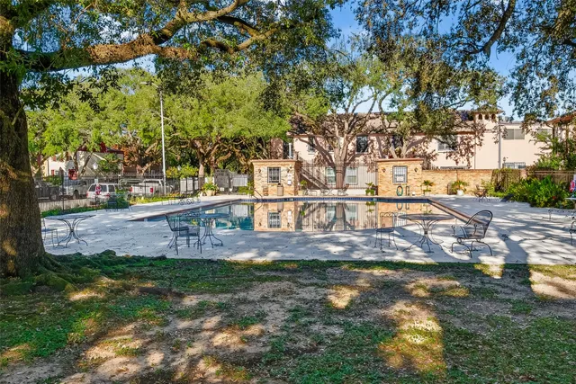 a view of yard with tree in the background