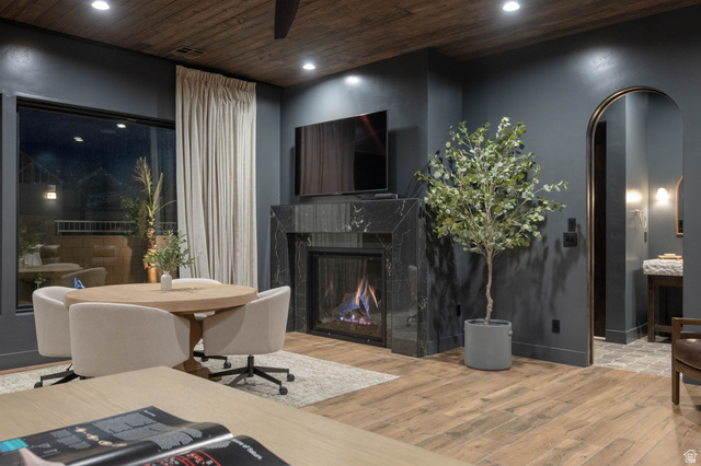 4871 South Homestead Way Washington, UT 84780 - Photo 102 of 151 Living room featuring arched walkways, light wood finished floors, recessed lighting, a premium fireplace, and wooden ceiling