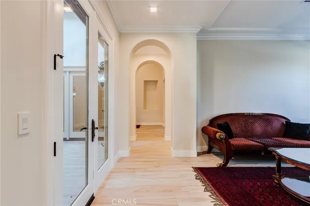 a kitchen with white cabinets and appliances
