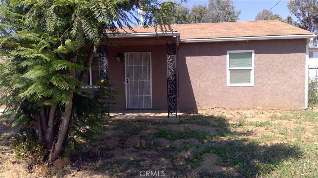 5961 Limonite Avenue Riverside, CA 92509 - Photo 1 of 1 a view of house with yard and tree in front of it