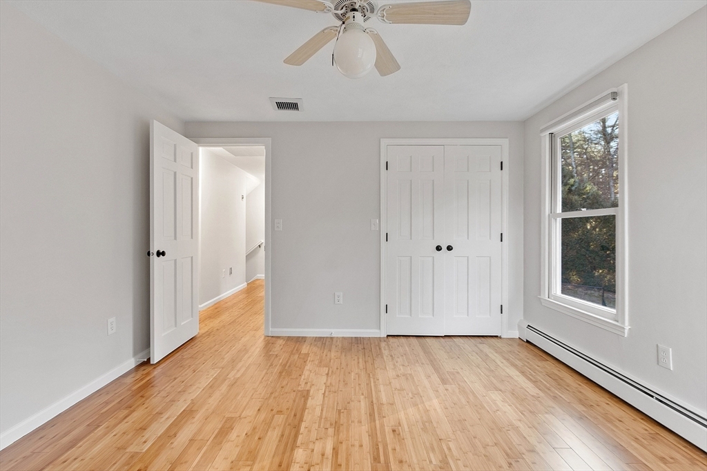 14 October Lane Stow, MA 01775 - Photo 27 of 41 wooden floor in an empty room with a window