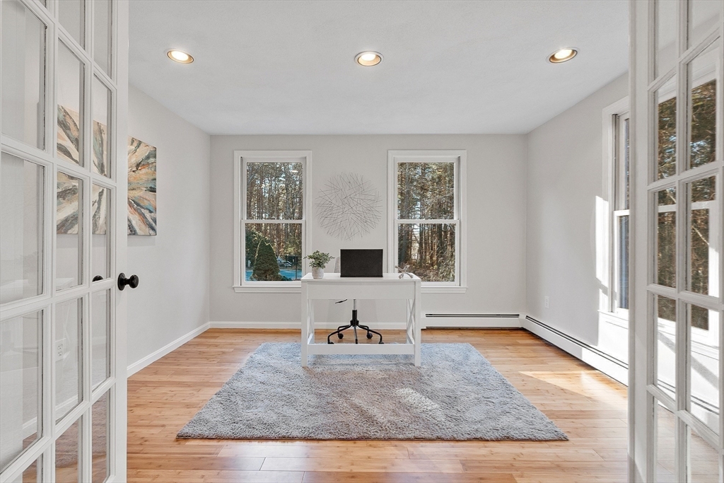 14 October Lane Stow, MA 01775 - Photo 7 of 41 a view of a livingroom with wooden floor and a window