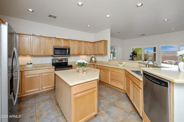 a kitchen with a sink stove and refrigerator