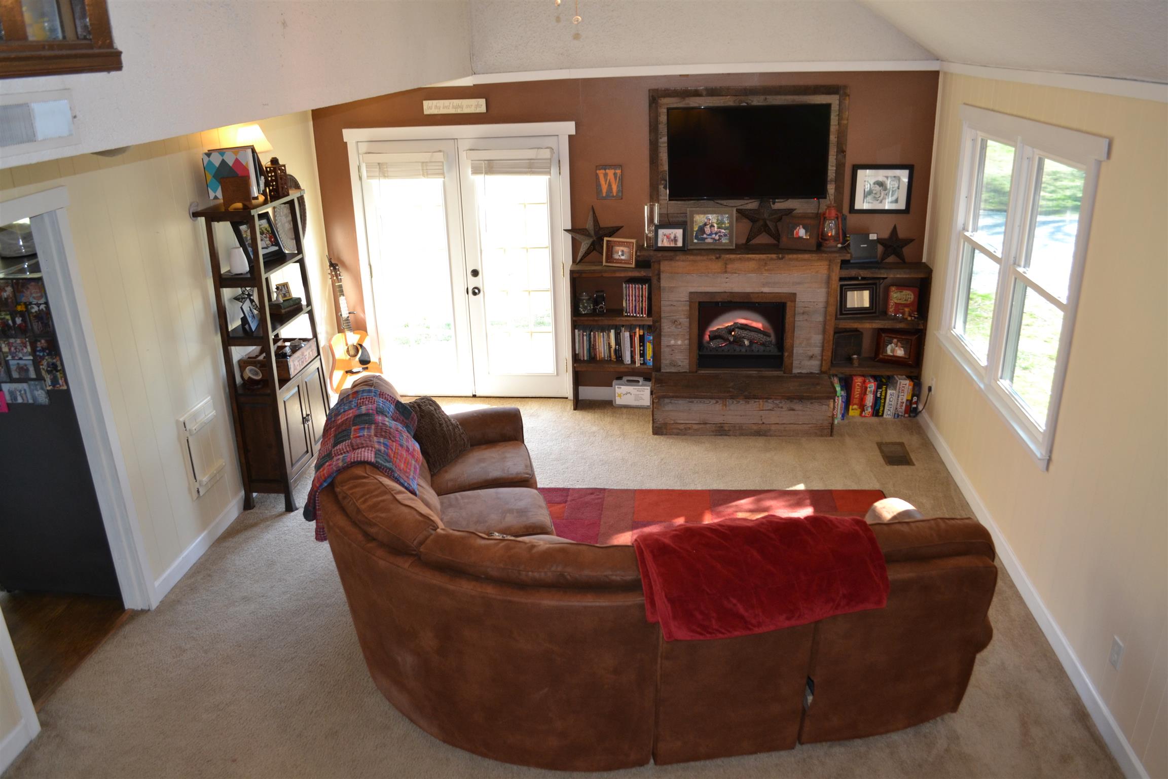 915 Hamilton Chambers Road Lebanon, TN 37087 - Photo 3 of 18 a living room with furniture and a fireplace