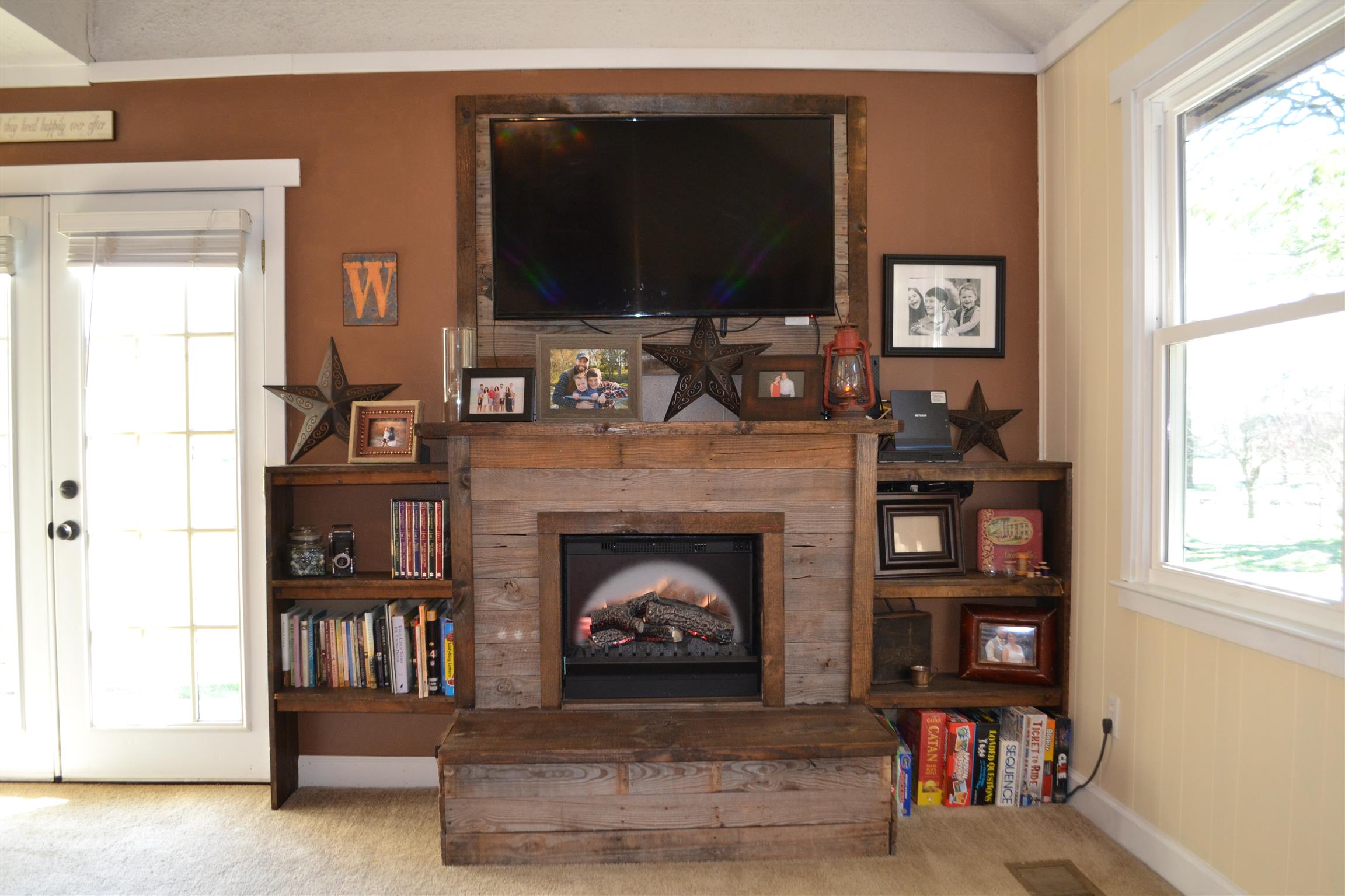 915 Hamilton Chambers Road Lebanon, TN 37087 - Photo 6 of 18 a living room with fireplace and a flat screen tv