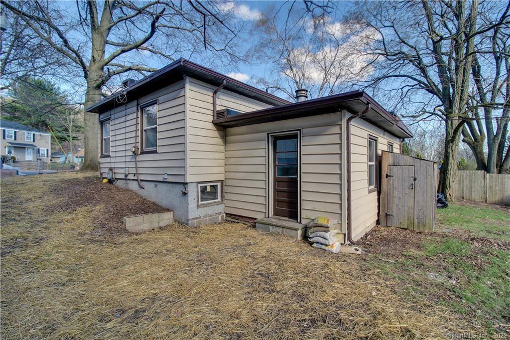 a view of a house with a yard and garage