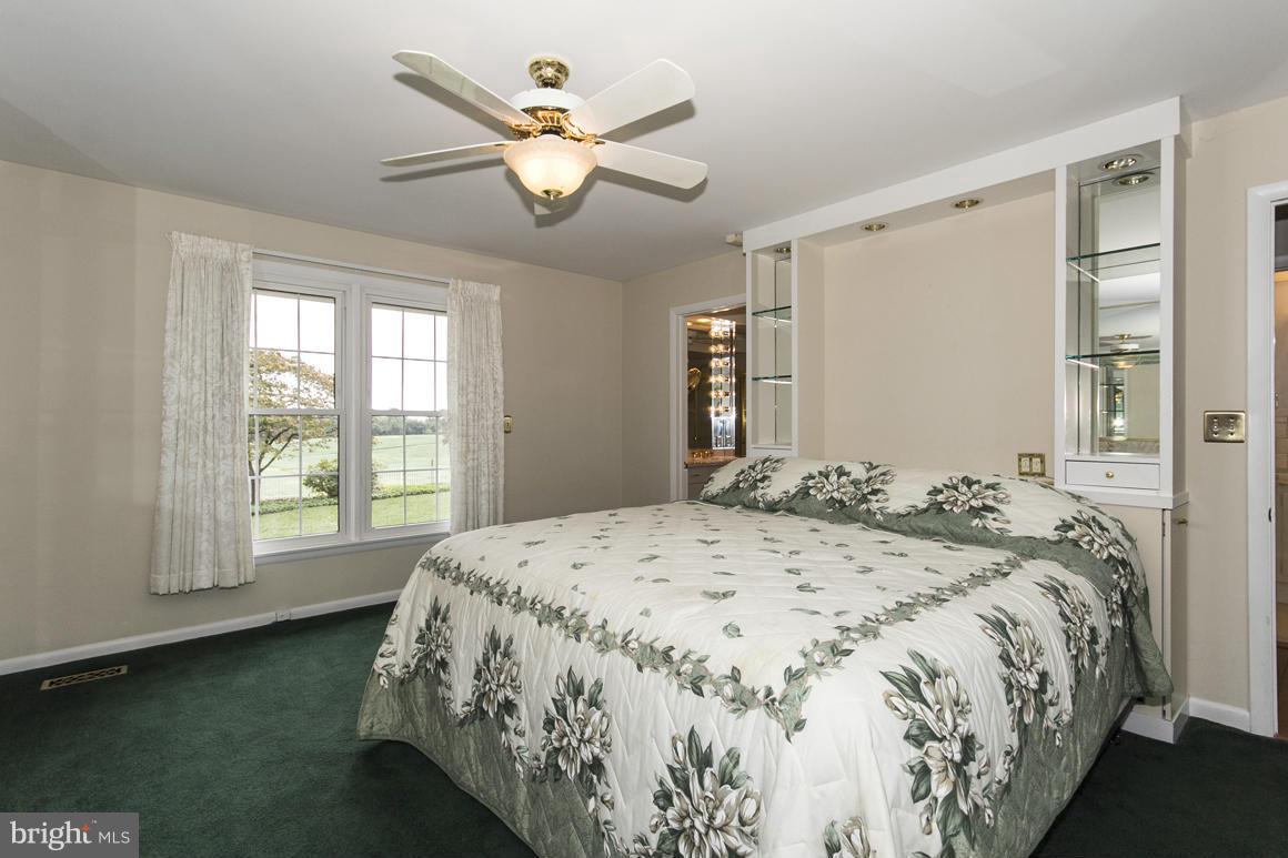 9911 Pepper Hill Road Perry Hall, MD 21128 - Photo 18 of 30 a bedroom with a large bed and a window