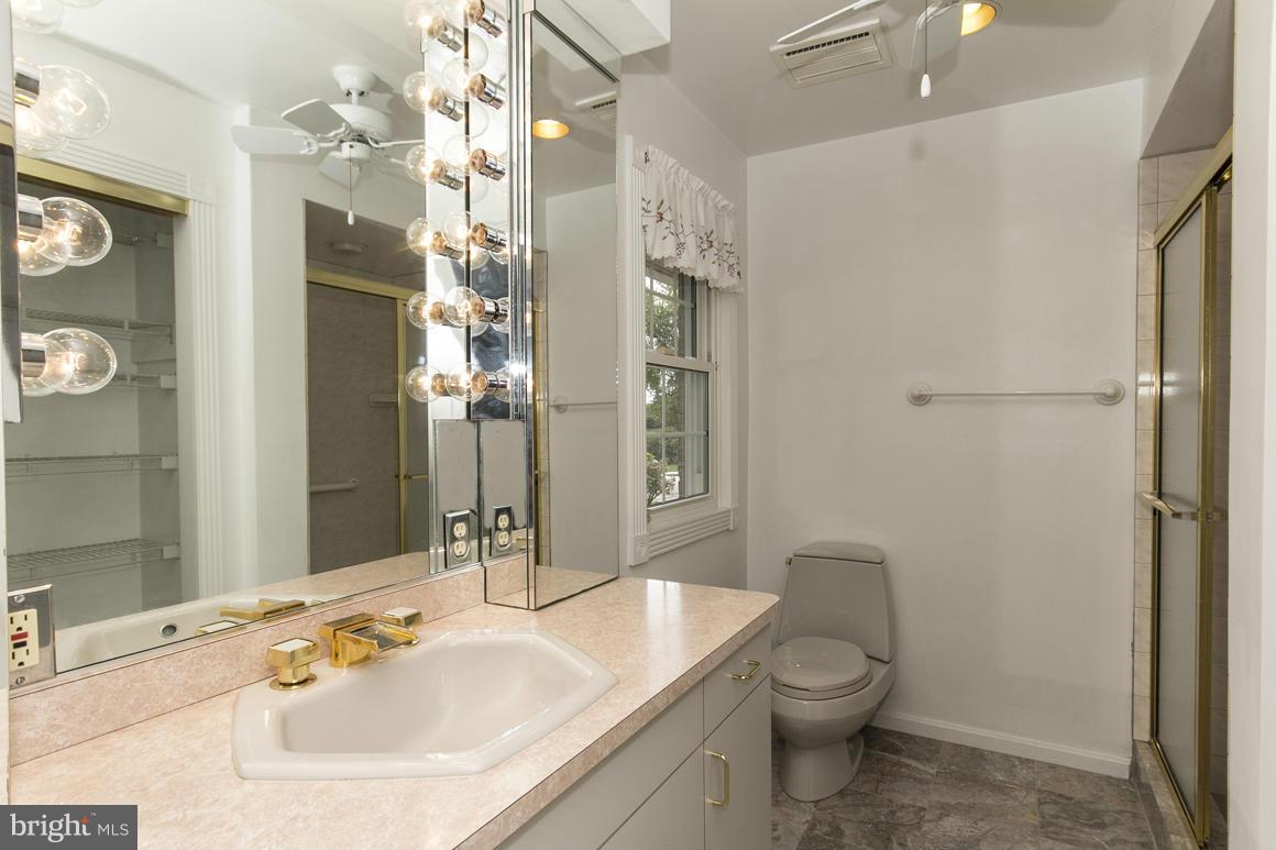9911 Pepper Hill Road Perry Hall, MD 21128 - Photo 20 of 30 a bathroom with a sink toilet and shower