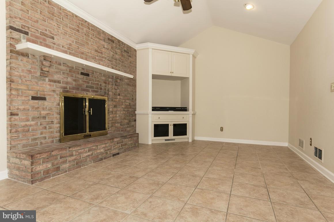 9911 Pepper Hill Road Perry Hall, MD 21128 - Photo 9 of 30 a view of an empty room with a fireplace
