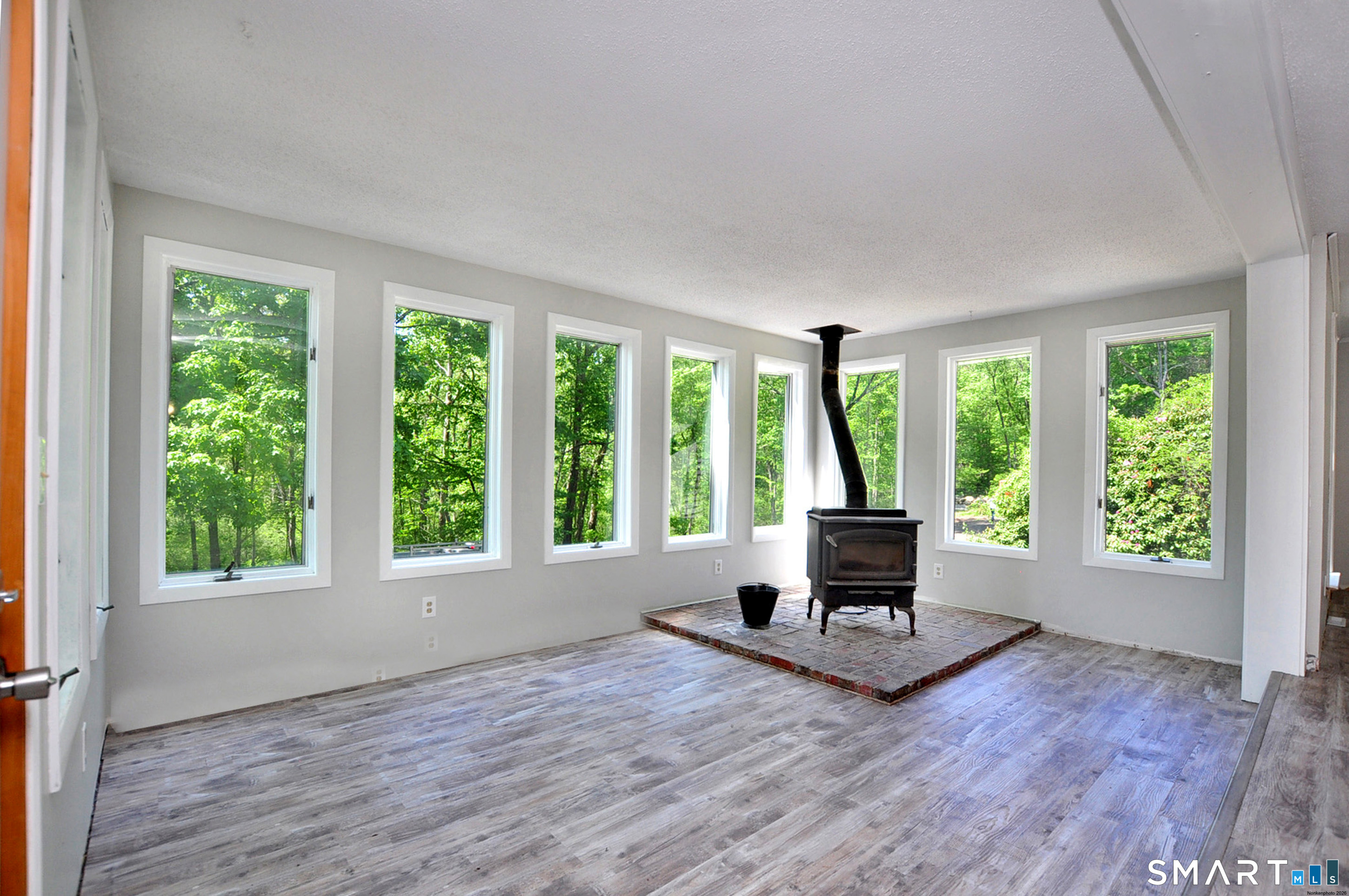 526 Granville Road Hartland, CT 06027 - Photo 11 of 37 Beautiful sunroom. Lots of windows with beautiful light