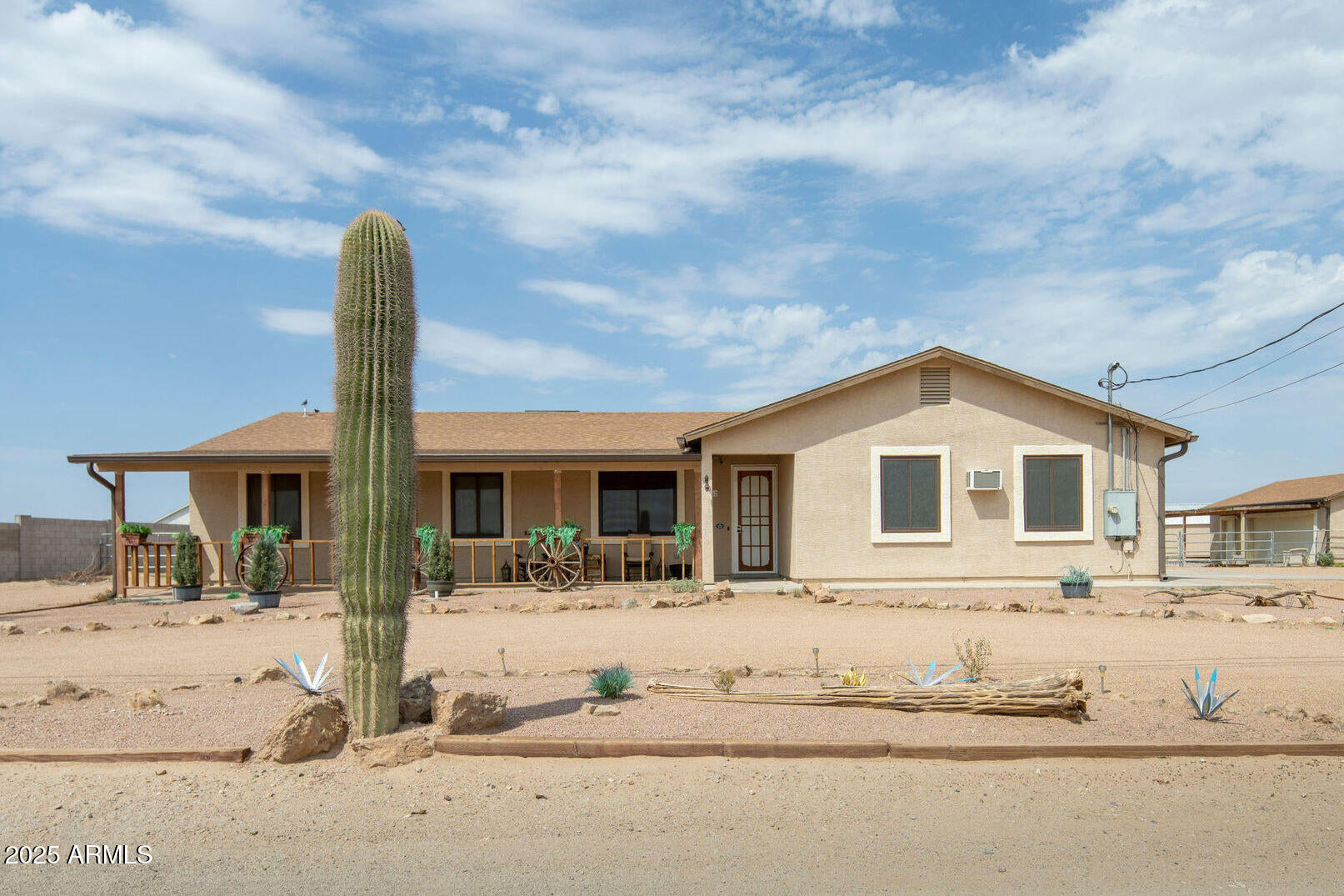 29362 North Varnum Road San Tan Valley, AZ 85143 - Photo 1 of 27 a front view of a house with a yard covered with snow