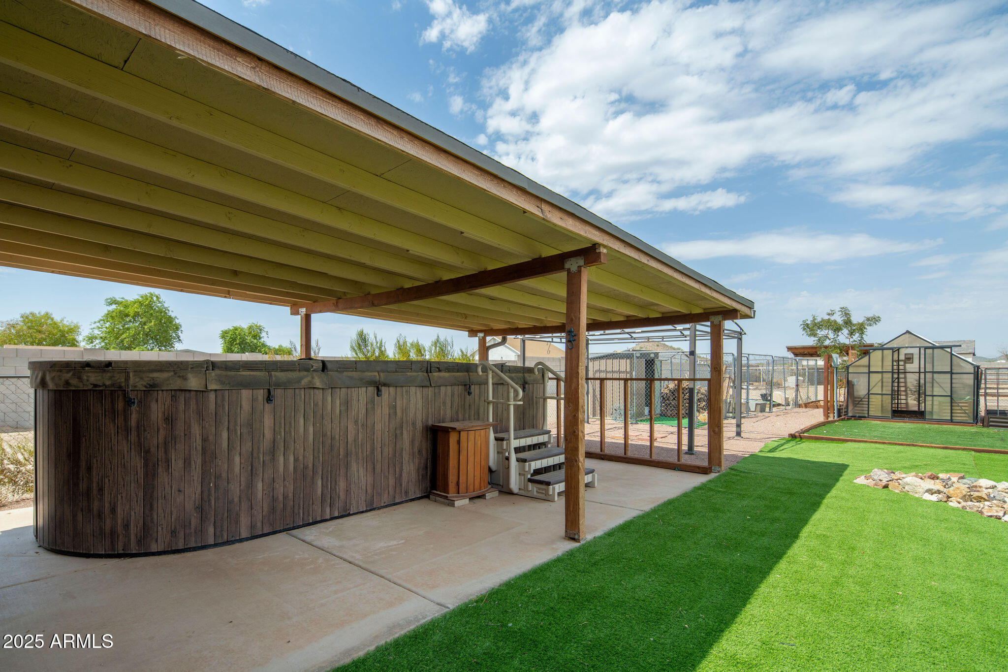 29362 North Varnum Road San Tan Valley, AZ 85143 - Photo 21 of 27 a view of a backyard with wooden fence
