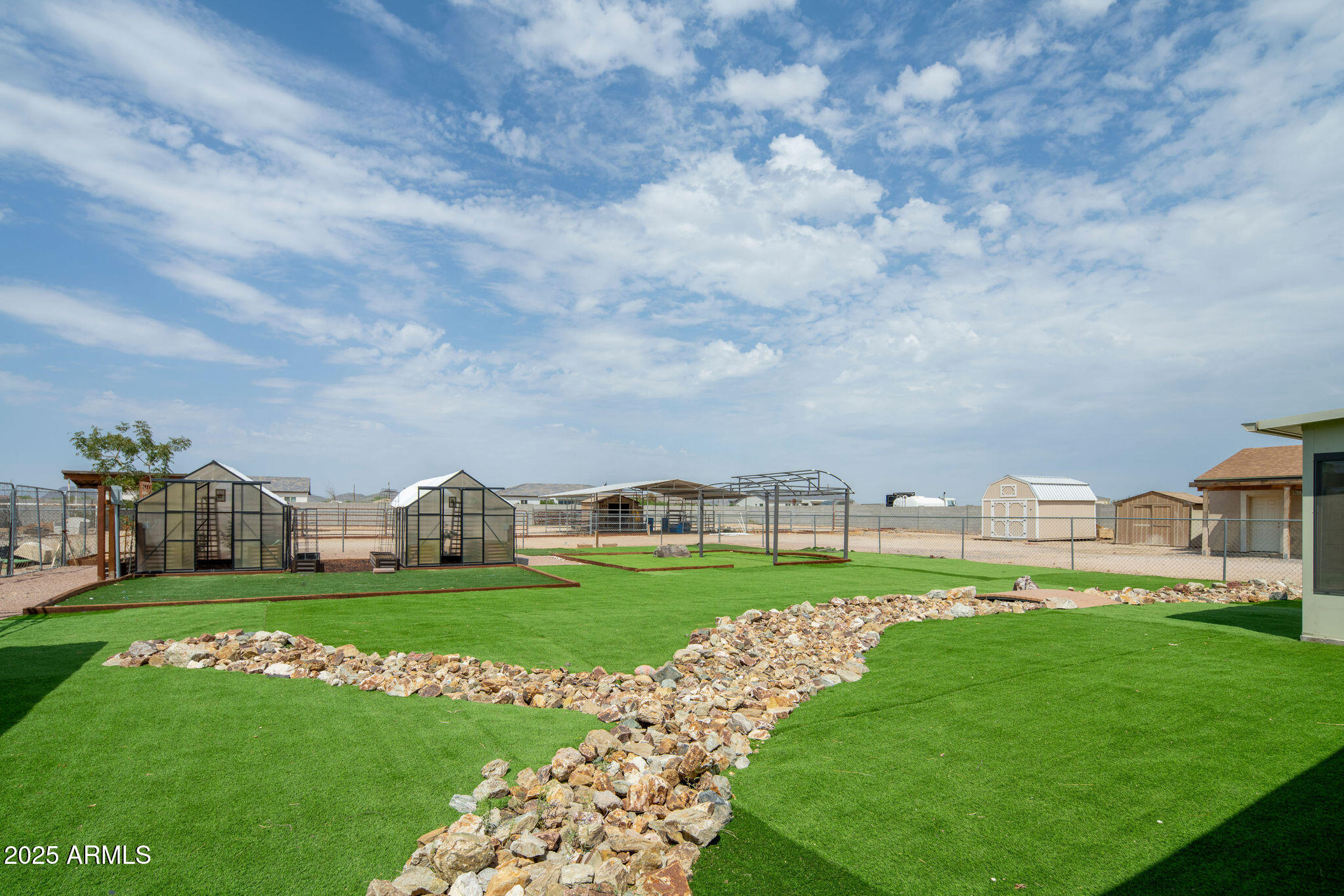 29362 North Varnum Road San Tan Valley, AZ 85143 - Photo 22 of 27 a view of a green field with house in the background