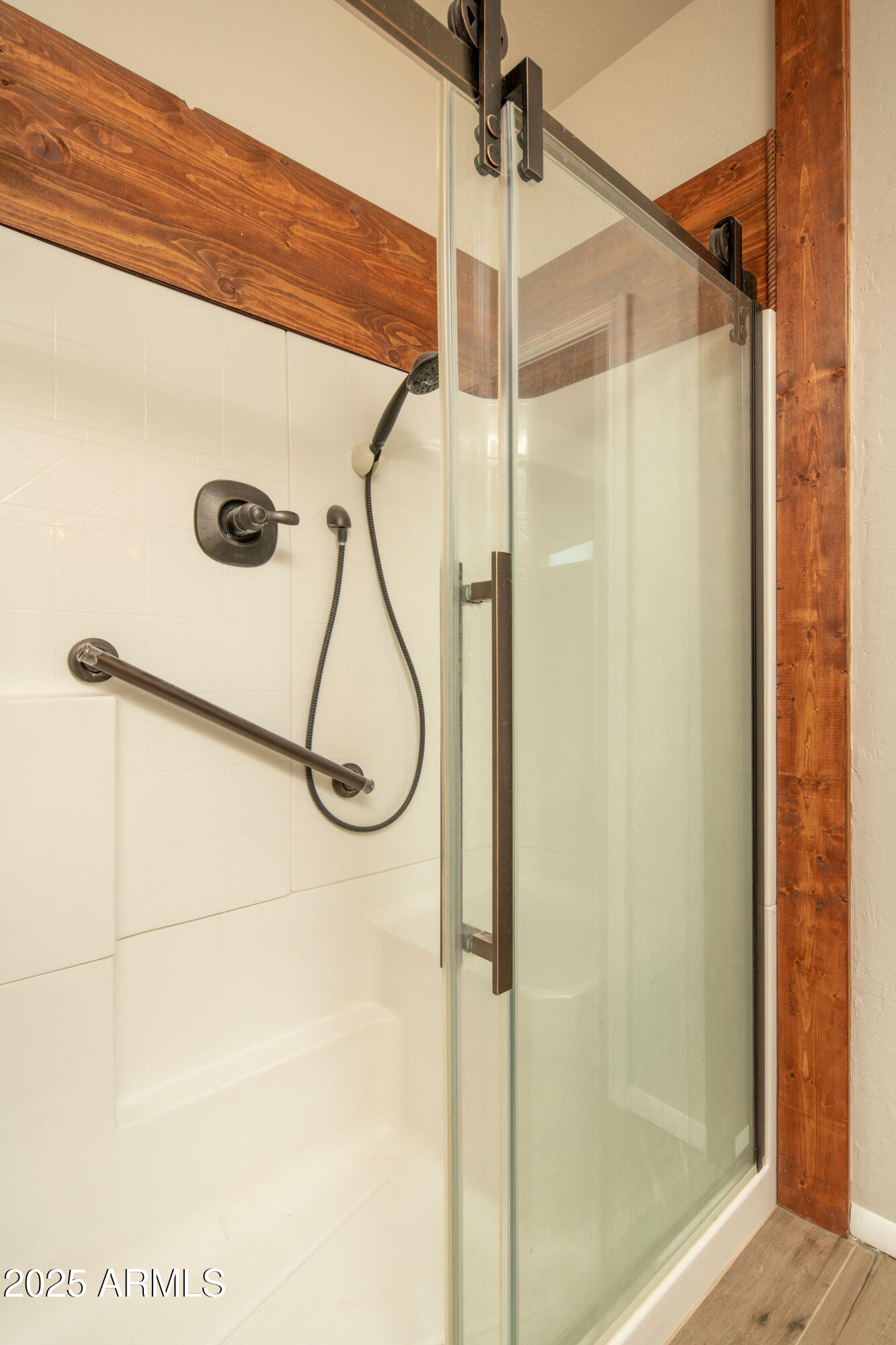29362 North Varnum Road San Tan Valley, AZ 85143 - Photo 6 of 27 a bathroom that has a glass shower door