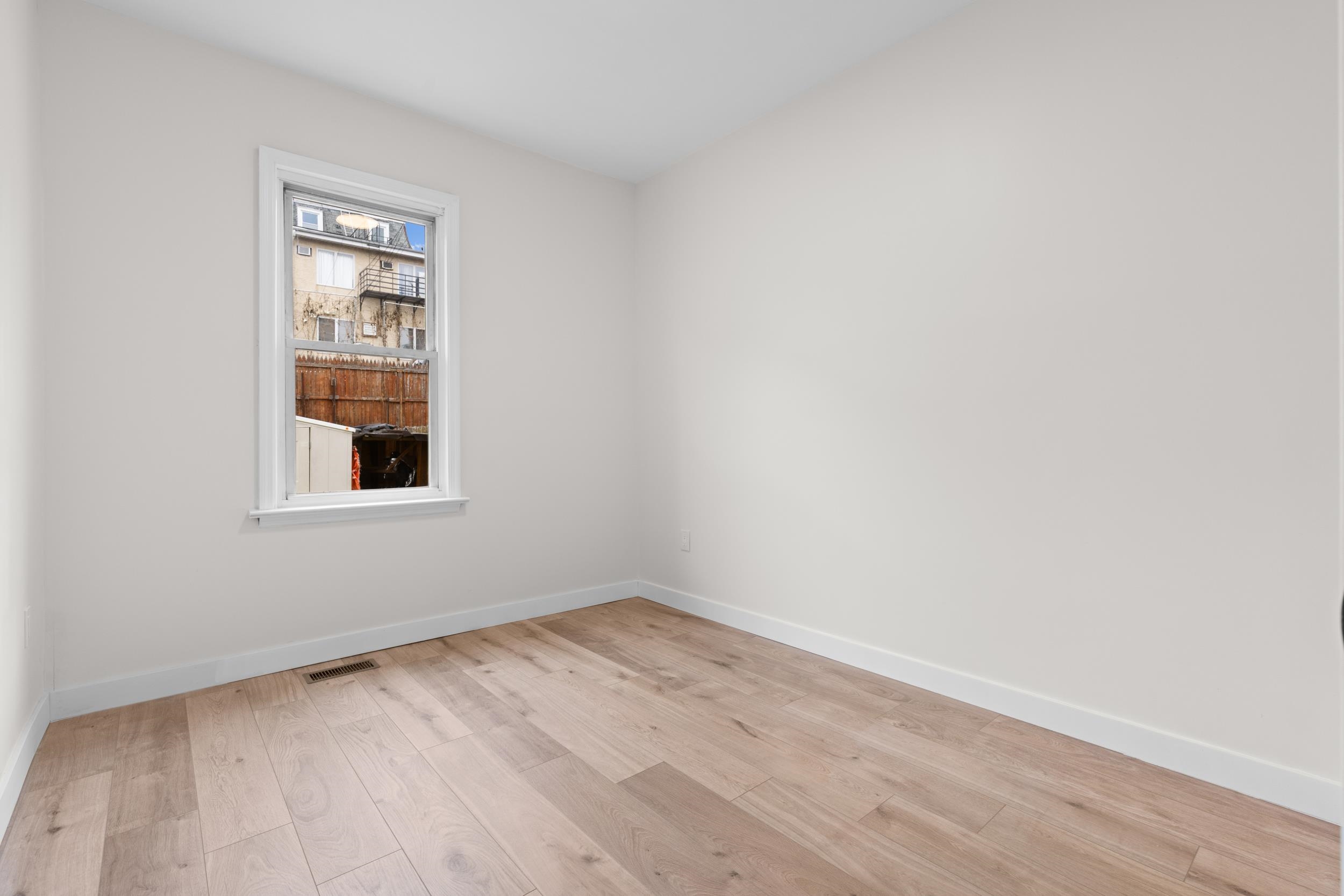 3 Edison Place, Unit 1 East Rutherford, NJ 07073 - Photo 11 of 21 an empty room with a window