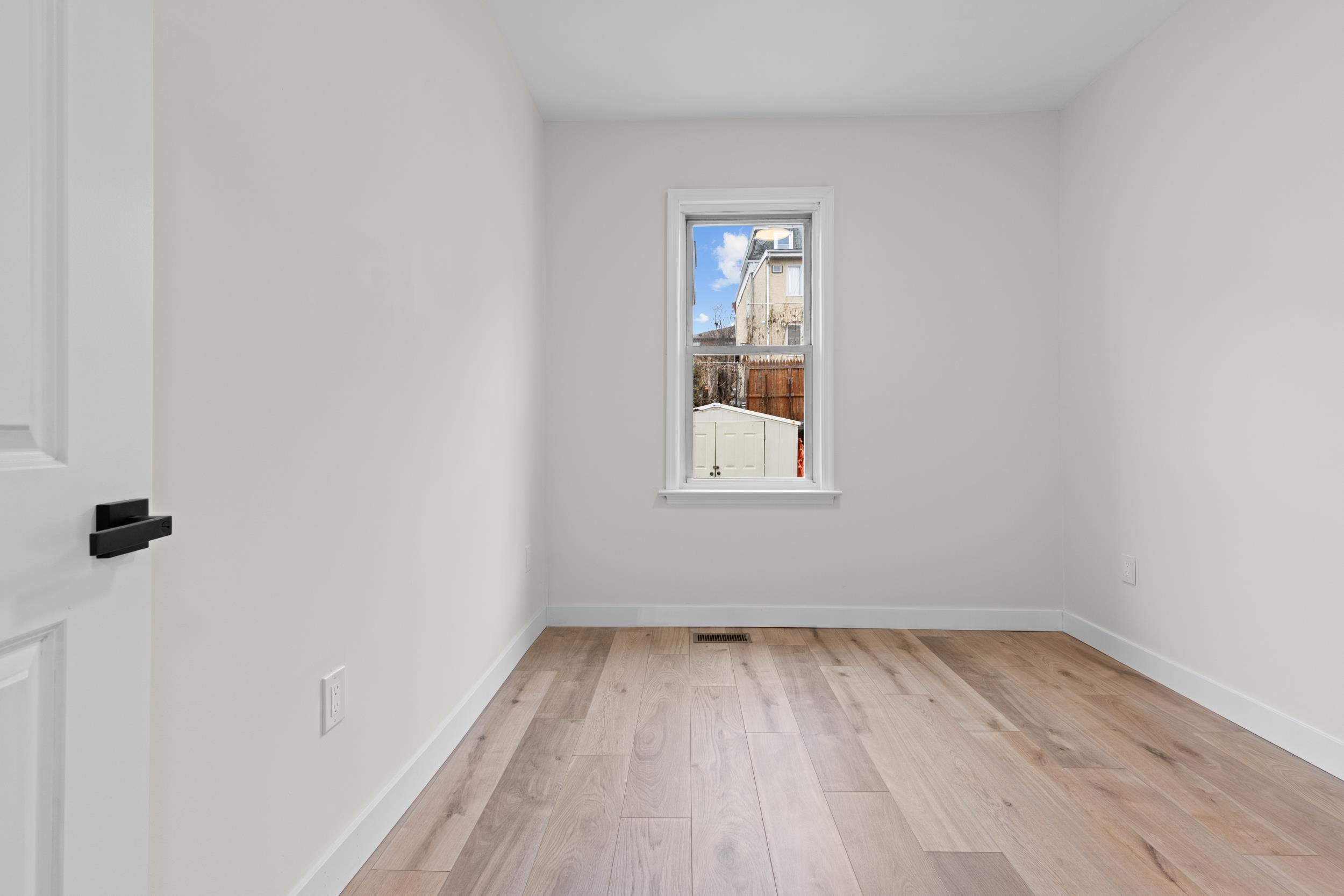3 Edison Place, Unit 1 East Rutherford, NJ 07073 - Photo 12 of 21 an empty room with a window