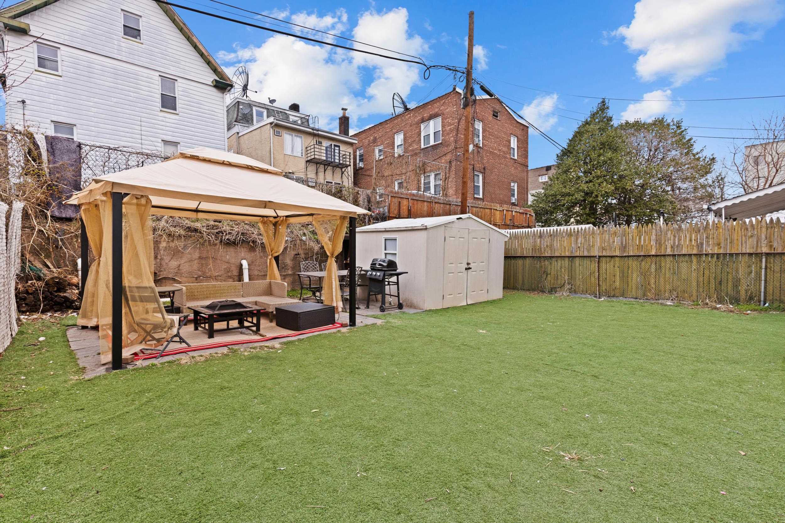 3 Edison Place, Unit 1 East Rutherford, NJ 07073 - Photo 17 of 21 a view of a house with backyard and porch