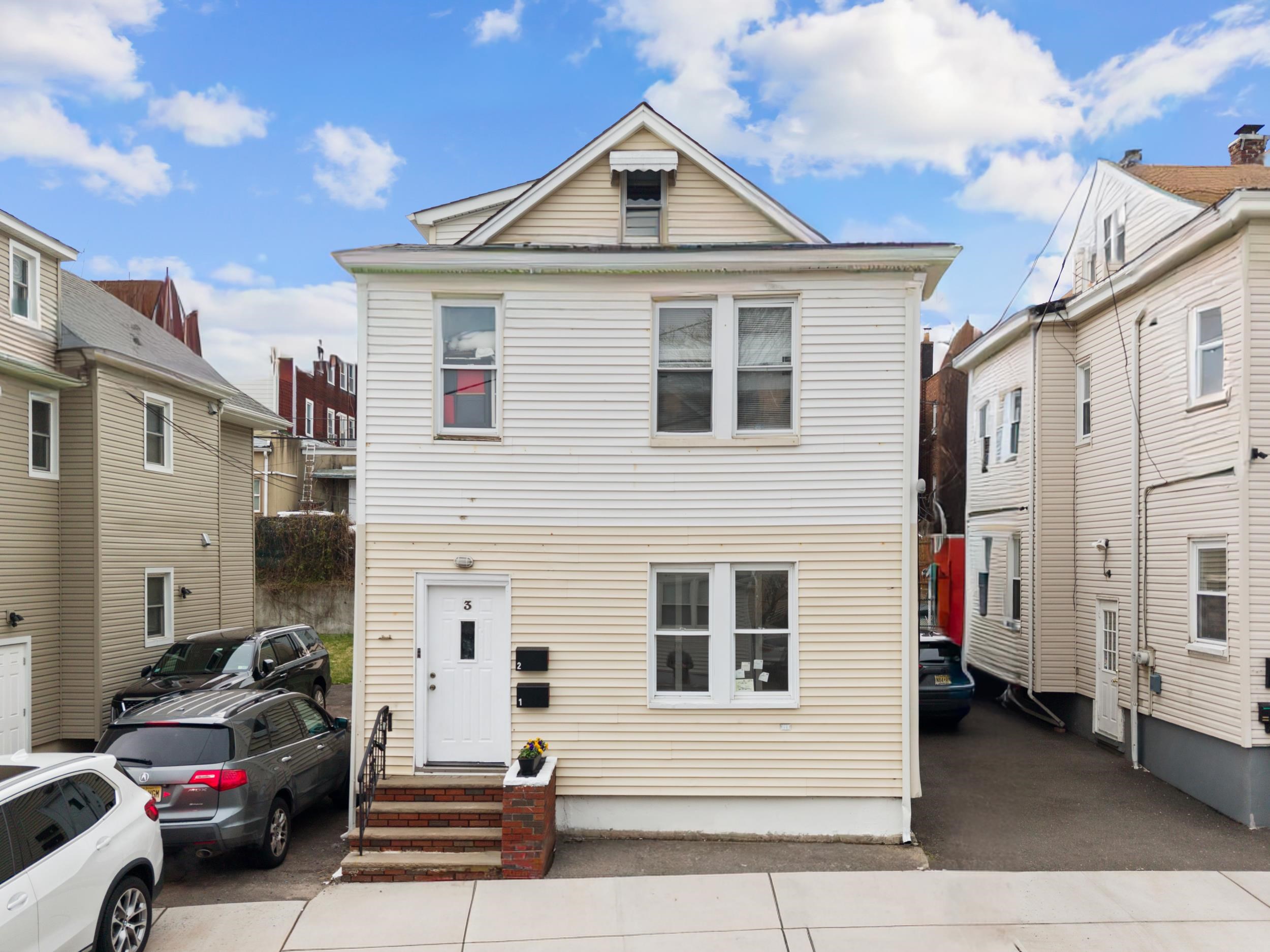 3 Edison Place, Unit 1 East Rutherford, NJ 07073 - Photo 19 of 21 a view of a white house with a sink and a refrigerator