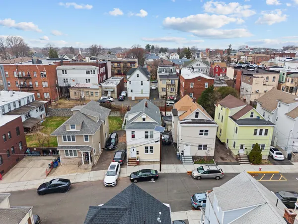an aerial view of residential building with parking