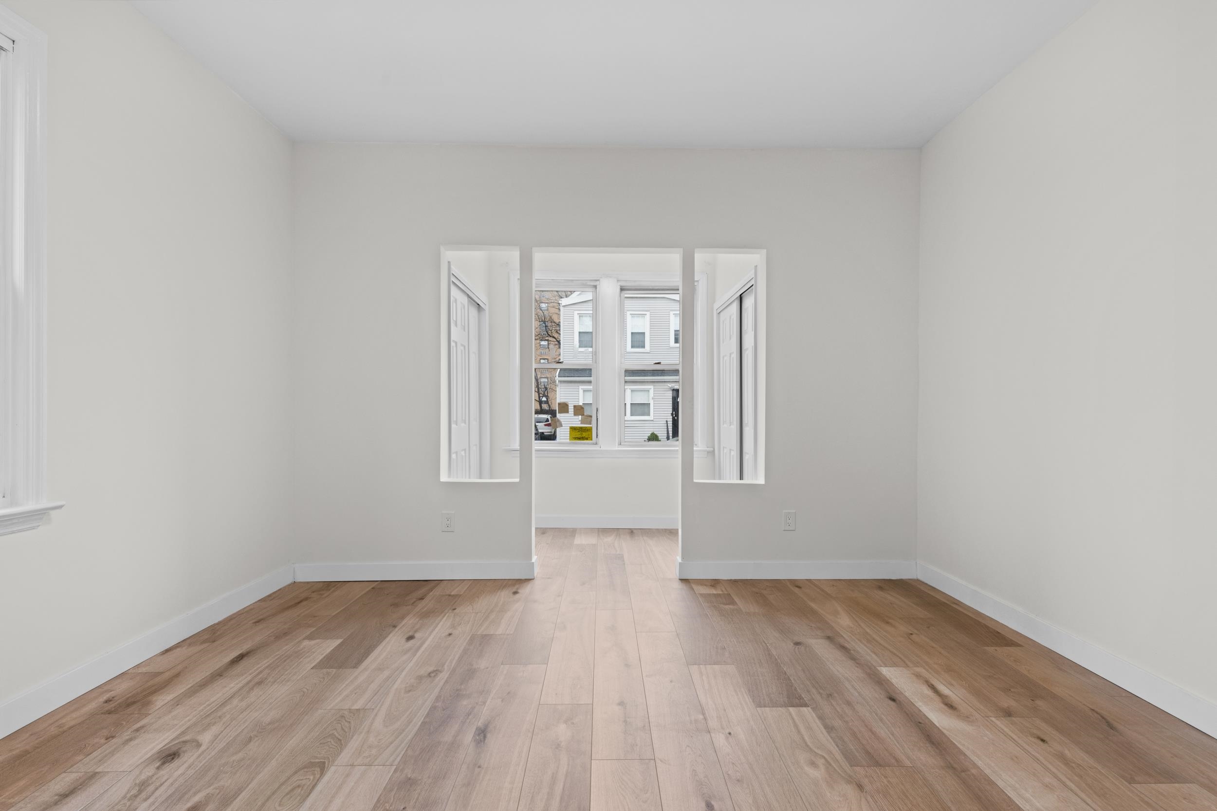 3 Edison Place, Unit 1 East Rutherford, NJ 07073 - Photo 4 of 21 wooden floor in an empty room