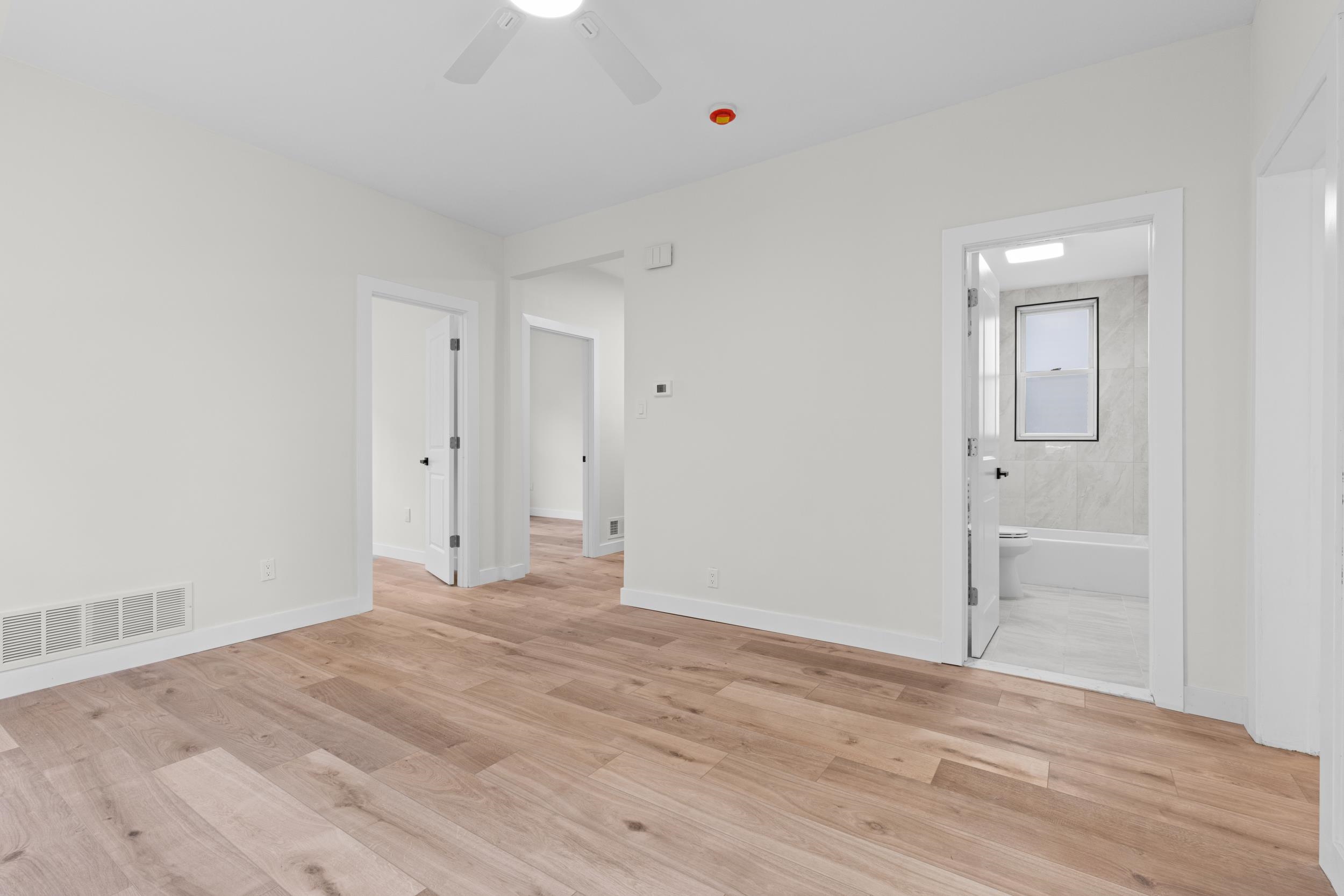 3 Edison Place, Unit 1 East Rutherford, NJ 07073 - Photo 5 of 21 wooden floor in an empty room