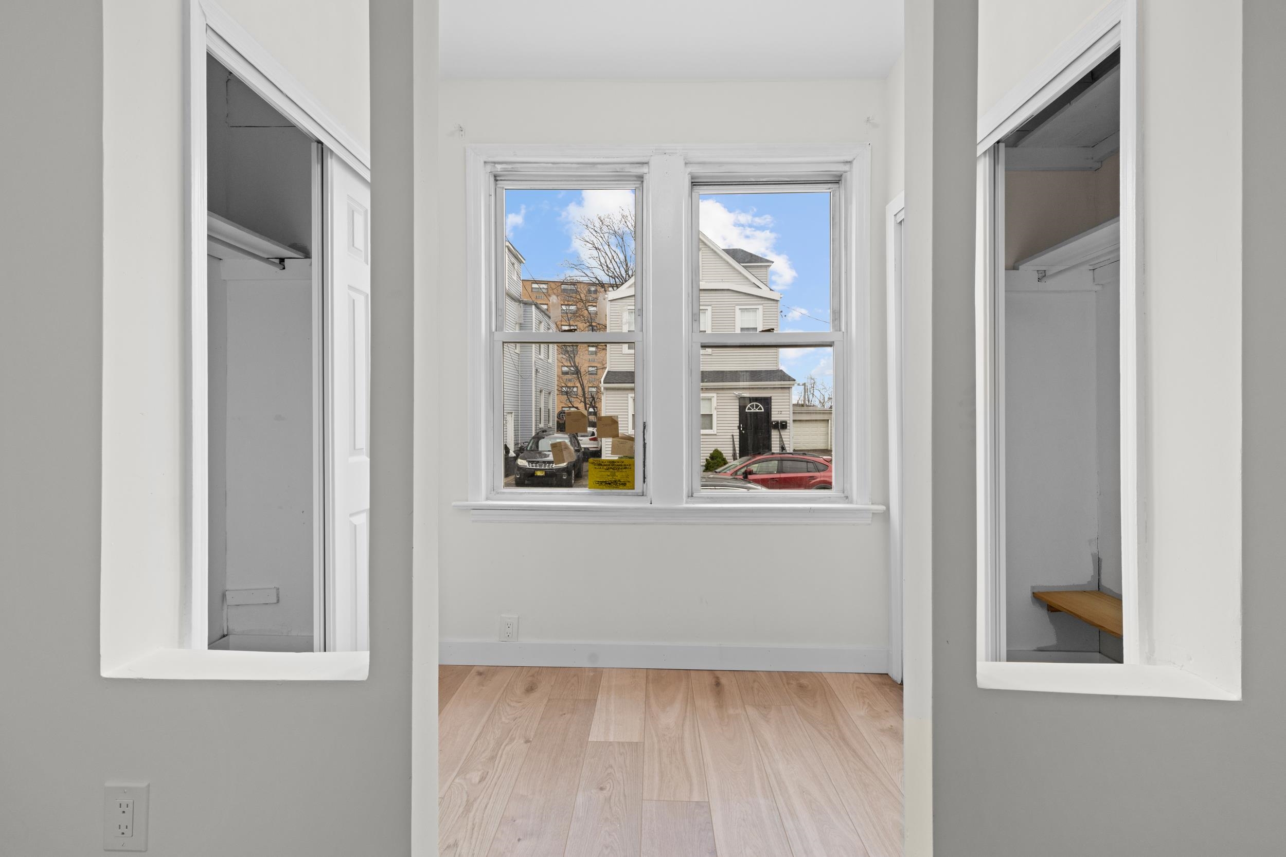3 Edison Place, Unit 1 East Rutherford, NJ 07073 - Photo 8 of 21 view of a room that has a window in it