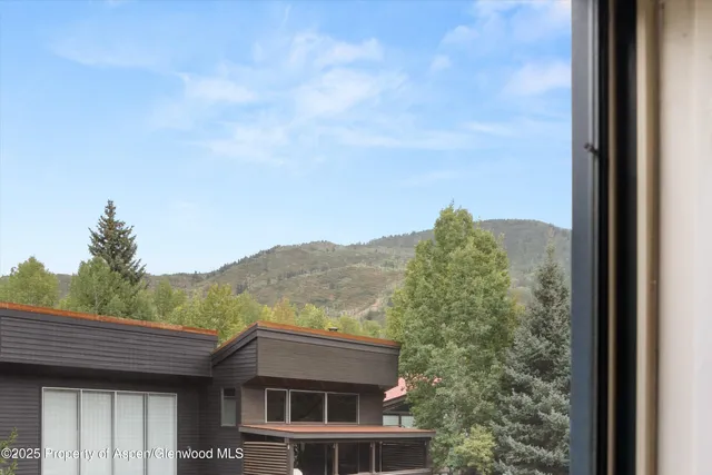 a view of a house with a mountain view from balcony