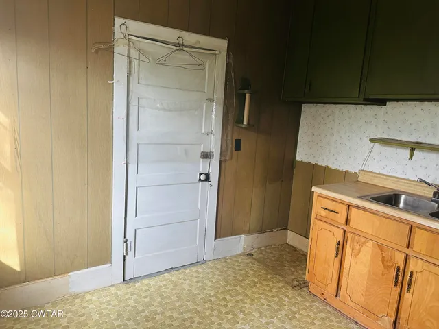 a view of a tiny house with a yard