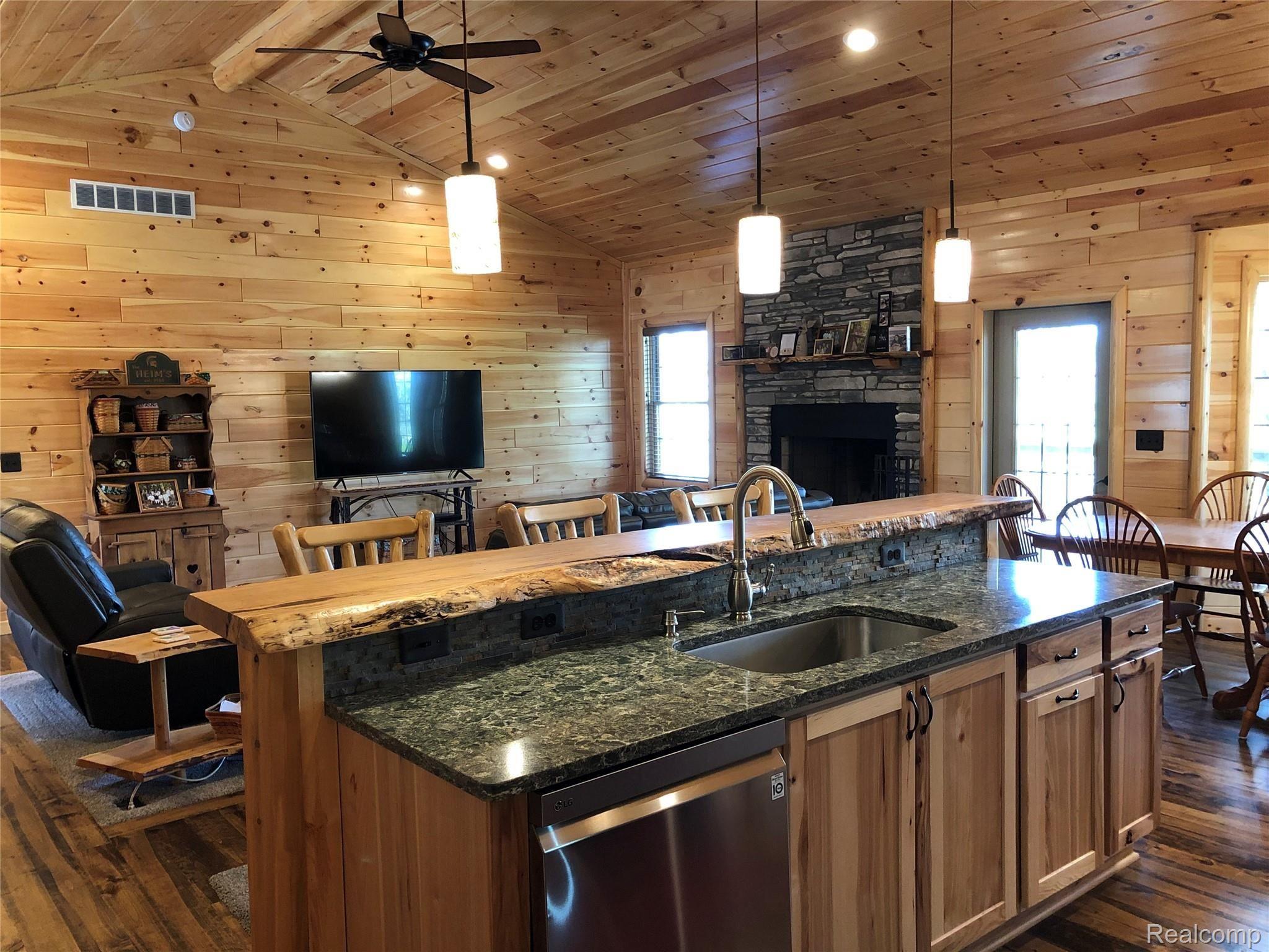 6263 General Squier Road Almont, MI 48003 - Photo 5 of 45 Great room, kitchen & dining area with spacious cathedral ceiling