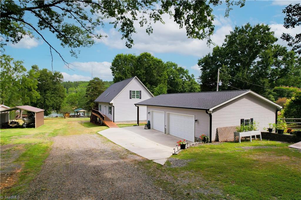 1241 Panther Point Road Richfield, NC 28137 - Photo 4 of 50 2 car heated and cooled detached garage with single car carport.