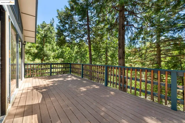 a view of balcony with wooden floor