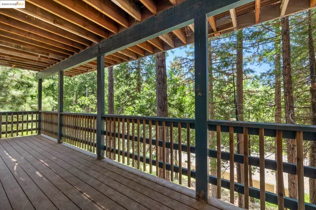 a view of porch with wooden floor