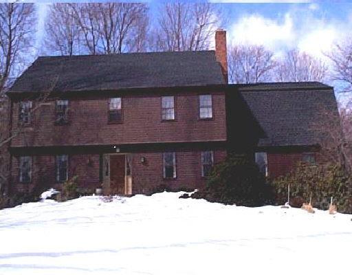 49 Rockwell Road Ridgefield, CT 06877 - Photo 1 of 1 a front view of a house with a yard covered in snow