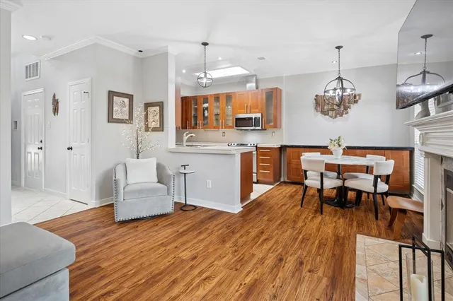 a kitchen with stainless steel appliances granite countertop a refrigerator stove and microwave