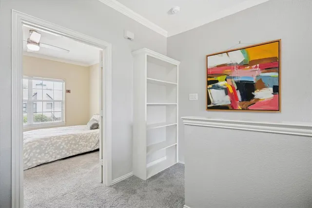 a bedroom with bed and a window