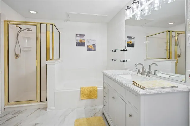 a close up view of a washer and dryer in a small white room