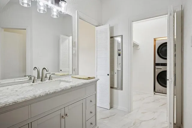 a view of a chair and tables in the patio