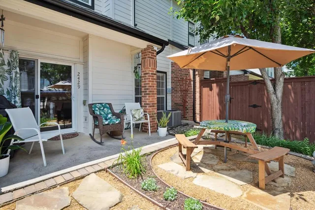 a view of a backyard with sitting area