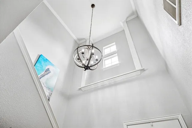 a view of a hallway with windows