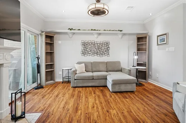 a living room with furniture fireplace and flat screen tv