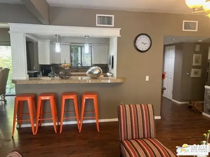 a dining room with chair and wooden floor