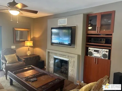 a living room with furniture and a fireplace