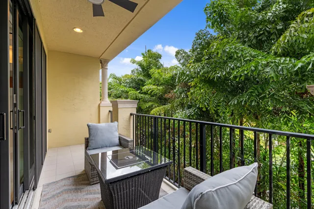 a view of a balcony with furniture