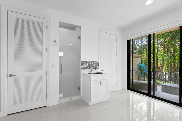 a view of a house with a small yard and plants