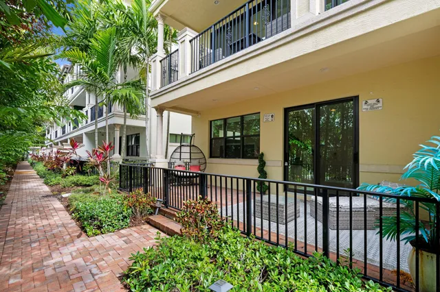 a bathroom with a granite countertop sink mirror toilet and bathtub