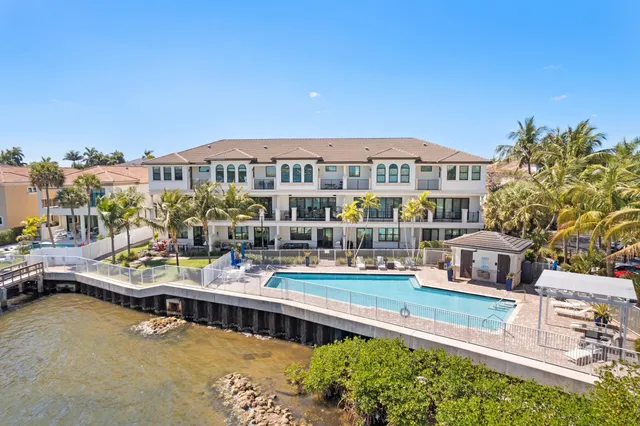 a view of a terrace with wooden floor and lake view